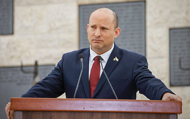 Israeli Prime Minister Naftali Bennett looks during a state memorial ceremony for victims of terror, at Mount Herzl military cemetery in Jerusalem, May 4, 2022. (Olivier Fitoussi/Flash90)