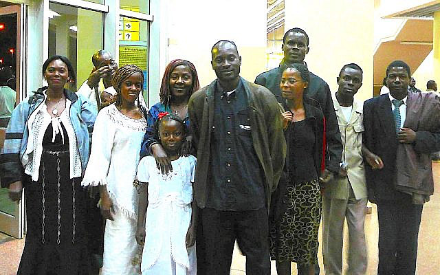 Serge Etele and community greeting us in airport. (courtesy)
