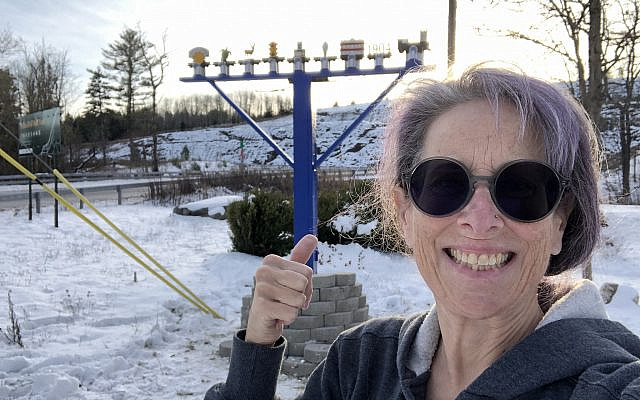 The author with the Parksville, NY Community Menorah. Photo courtesy of the author.