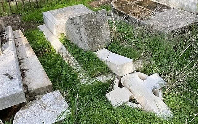Damaged tombstones at the Protestant Mount Zion Cemetery, in Jerusalem, January 3, 2023. (Israel Police)