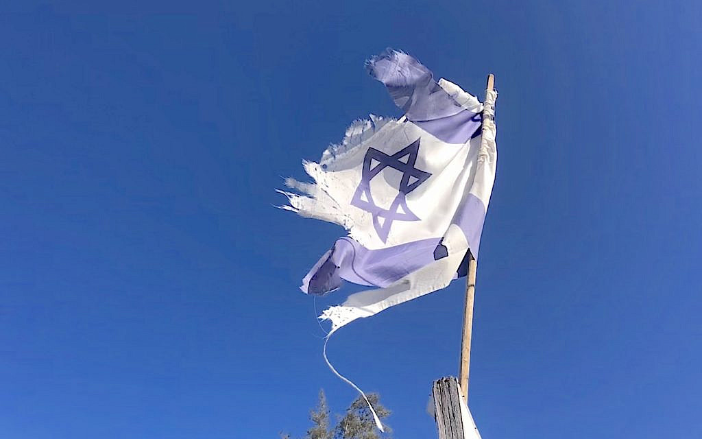 Torn Israeli flag, Beersheba, Dec. 30, 2022 (The Times of Israel/mh)