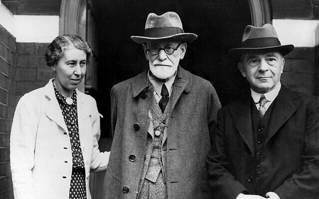 Jewish psychoanalyst Sigmund Freud, center, poses with his daughter Mathilde, left, and Dr. Ernest Jones on his arrival at his Hampstead home in London, England, on June 6, 1938.  Freud, 82, traveled from Paris after emigrating from Vienna to escape Nazi persecution.  (AP Photo)