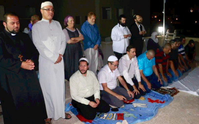 Jews, Muslims and Christians praying together. (courtesy)