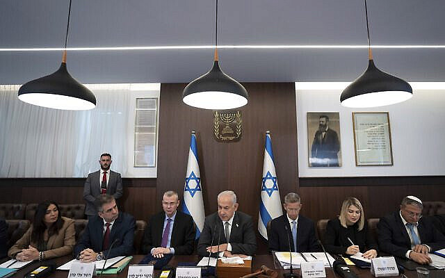Israeli Prime Minister Benjamin Netanyahu, center, chairs the weekly cabinet meeting in Jerusalem, February 12, 2023. (AP Photo/ Ohad Zwigenberg, Pool)