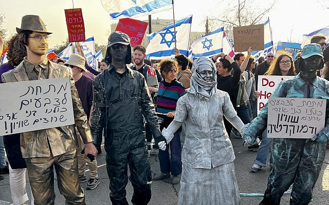 'Cursed are those who know and keep silent', 20 Feb Knesset demonstration. Photo credit: Diana Lipton