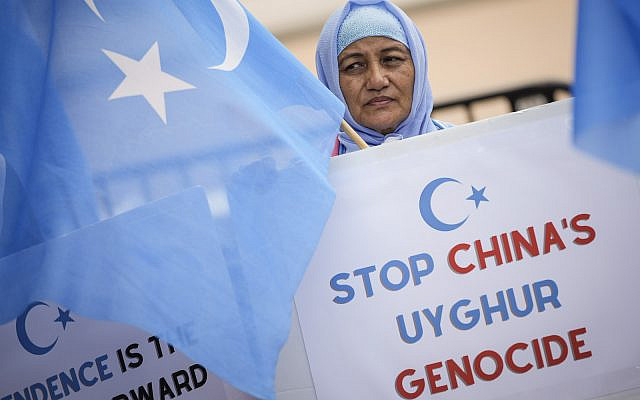 Supporters of the East Turkistan National Awakening Movement rally in front of the White House to commemorate the 13th anniversary of the July 5th Urumqi Massacre, July 5, 2022 in Washington, DC. (Drew Angerer / GETTY IMAGES NORTH AMERICA / Getty Images via AFP)