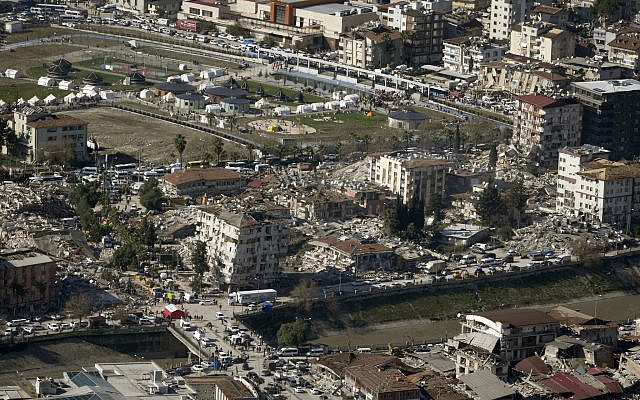 Collapsed buildings are seen in Antakya, southern Turkey, February 8, 2023. Nearly two days after the magnitude 7.8 quake struck southeastern Turkey and northern Syria, thinly stretched rescue teams work to pull more people from the rubble of thousands of buildings. (AP Photo/Khalil Hamra)