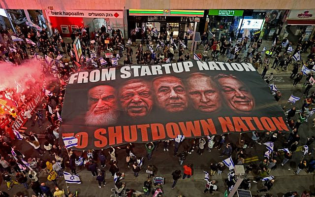 Israelis take part in ongoing protests against controversial legal reforms being touted by the country's hard-right government, in Tel Aviv on February 25, 2023. (Photo by JACK GUEZ / AFP)