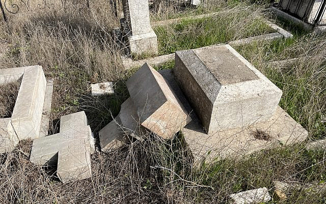 Broken cross from tombstone in Protestant cemetery vandalized on 3 January 2023.  (Oliver Hersey)