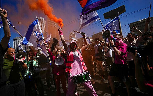 Demonstrators block a highway during a protest against plans by Prime Minister Benjamin Netanyahu's government to overhaul the judicial system, in Tel Aviv, Israel, March 16, 2023. (AP/Ohad Zwigenberg)