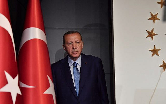 Turkish President Recep Tayyip Erdogan arrives to deliver a speech on June 24, 2018 in Istanbul, after initial results of Turkey's presidential and parliamentary elections. 
Erdogan on June 24 declared victory in a tightly-contested presidential election, extending his 15-year grip on power in the face of a revitalised opposition. Turkish voters had for the first time cast ballots for both president and parliament in the snap polls, with Erdogan looking for a first round knockout and an overall majority for his ruling Justice and Development Party (AKP).
 / AFP PHOTO / Bulent Kilic