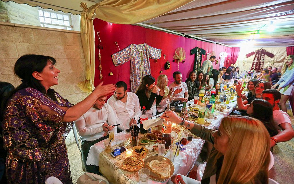 Israelis at a Mimuna celebrations in the city of Beit Shemesh on April 7, 2018. (Yaakov Lederman/Flash90)