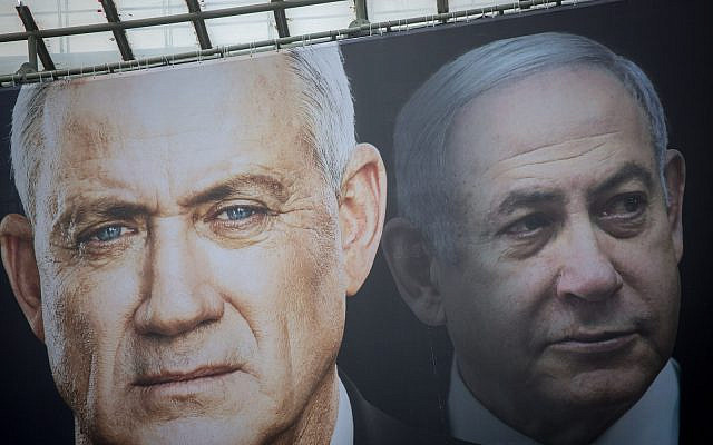 Election posters hung by the Blue and White party shows their candidate Benny Gantz and Israeli prime minister Benjamin Netanyahu with a Hebrew slogan reading 'Netanyahu cares only for himself', ahead of the Israeli elections. February 18, 2020. (Miriam Alster/FLASH90)