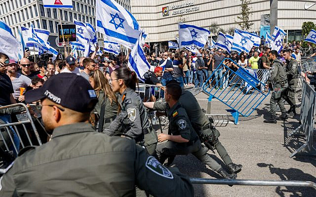 Israelis clash with police during a protest against the Israeli government's planned judicial overhaul, in Tel Aviv, March 1, 2023. (Erik Marmor/Flash90)