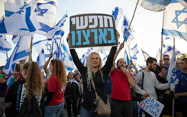 Protesters rally against the Israeli government's judicial overhaul at Karkur junction, on March 27, 2023. (Shir Torem/ Flash90)
