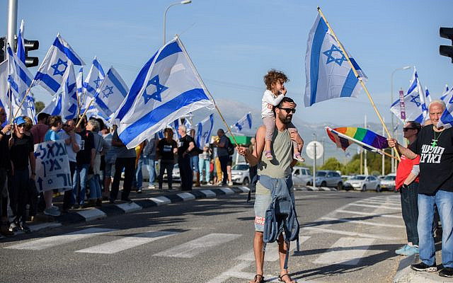 Israelis protest against the Israeli government's planned judicial overhaul, at the Goma junction, northern Israel, on April 15, 2023. (Ayal Margolin/Flash90)