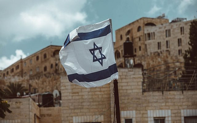 Israeli flag flown in Jerusalem on September 5, 2020. Photographer: Taylor Brandon via Unsplash