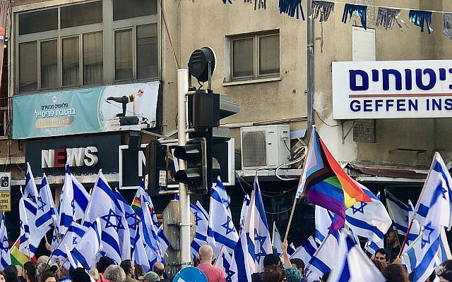 Protestors gather on streets and towns throughout Israel. This photo was taken in Givatyaim in June 2023. Photo credit: Sari Ellen
