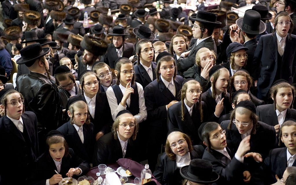 Illustrative: Boys at a gathering of the Satmar Hasidic communityin Brooklyn NY, December 17, 2011, marking the 67th anniversary of the rescue of their founder, Rabbi Joel Teitelbaum, from the Nazis. (Don Emmert / AFP)