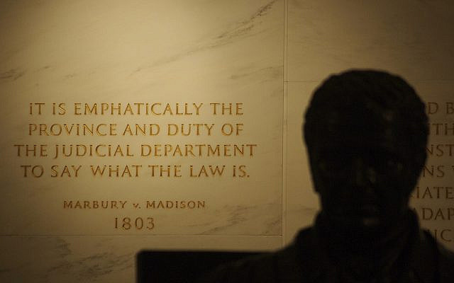 Inscription on the wall of the United States Supreme Court Building from Marbury v. Madison, in which Chief Justice John Marshall (his statue in the foreground) outlined the concept of judicial review. (Wikipedia)