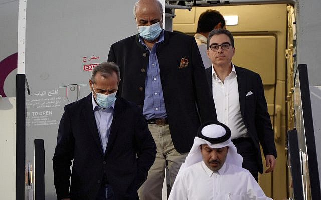 From left, Emad Sharghi, Morad Tahbaz and Siamak Namazi, former prisoners in Iran, walk out of a Qatar Airways flight that brought them out of Tehran and to Doha, Qatar, Monday, Sept. 18, 2023. Five prisoners sought by the US in a swap with Iran were freed Monday and headed home as part of a deal that saw nearly $6 billion in Iranian assets unfrozen. (AP Photo/Lujain Jo)