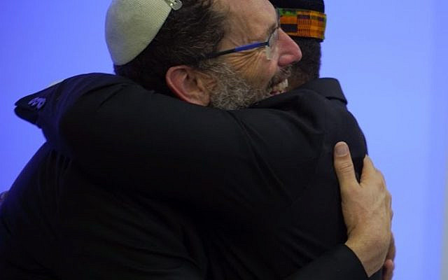 Hug with Imam Talib Sharif.
credit: sharaka