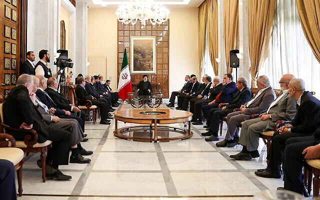 In this handout photo, Iranian President Ebrahim Raisi meets with senior Palestinian officials, including leaders of the Hamas and Islamic Jihad terror groups, in the Syrian capital Damascus on May 4, 2023. (Iranian Presidency Office)