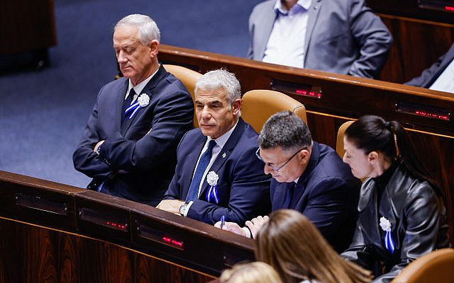 Sitting from left to right: Outgoing Defense Minister Benny Gantz, outgoing Prime Minister Yair Lapid, outgoing Justice Minister Gideon Sa'ar, and outgoing Transportation Minister Merav Michaeli, at the swearing-in ceremony of the 25th Knesset, in Jerusalem, November 15, 2022. (Olivier Fitoussi/ Flash90)