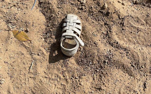 Toddler's shoe in Kibbutz Kfar Aza.... (courtesy)