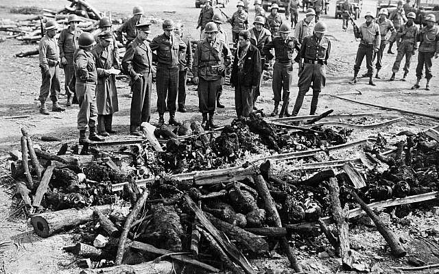 General Dwight Eisenhower inspects charred remains of prisoners at Ohrdruf concentration camp. (Wikipedia)