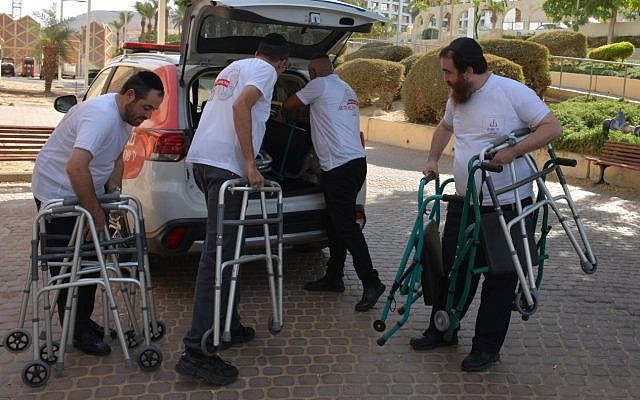 Yad Sarah volunteers set up temporary branch for evacuees in the dead sea. Courtesy of Yad Sarah