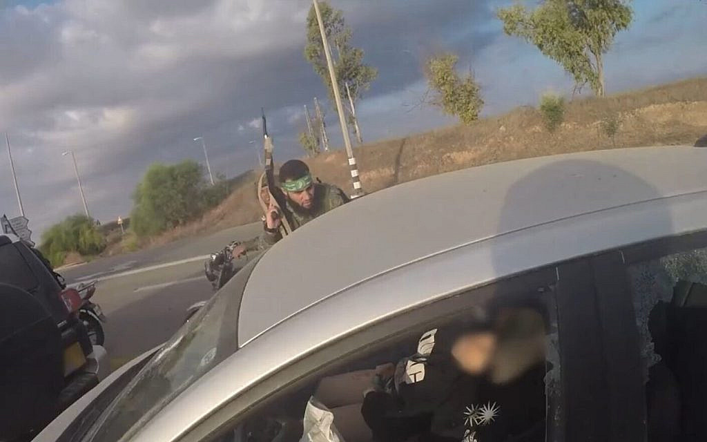 Screenshot of Hamas bodycam footage as terrorists approach an Israeli vehicle during the terror organization's October 7, 2023 attack in southern Israel, released by the IDF and GPO. (Screenshot)