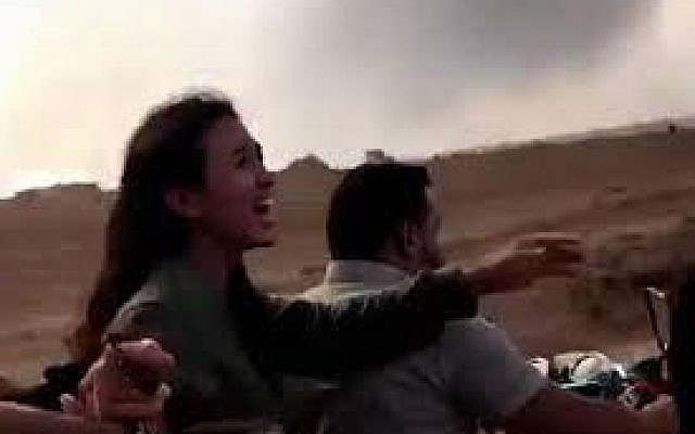 Screenshot of a woman being kidnapped taken from a Hamas video