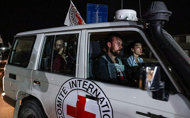 Illustrative: An International Red Cross vehicle carrying Israeli Russian hostage Ron Krivoy released by Hamas drives towards the Rafah border point with Egypt ahead of a transfer to Israel on November 26, 2023. (Mohammed ABED / AFP)