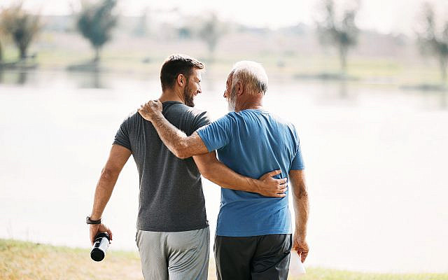 Illustrative: Father and son embracing. Envato stock photo. Used with permission.