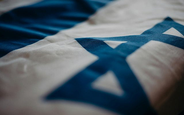 Photo by cottonbro studio from Pexels: https://www.pexels.com/photo/close-up-of-the-flag-of-israel-4033852/