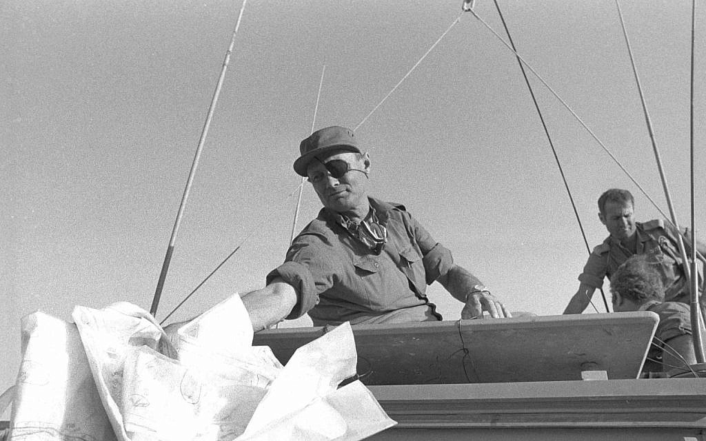 Then-defense minister Moshe Dayan visits the Sinai Peninsula during the Yom Kippur War, on October 20, 1973. (Bamahane/ Defense Ministry Archive)