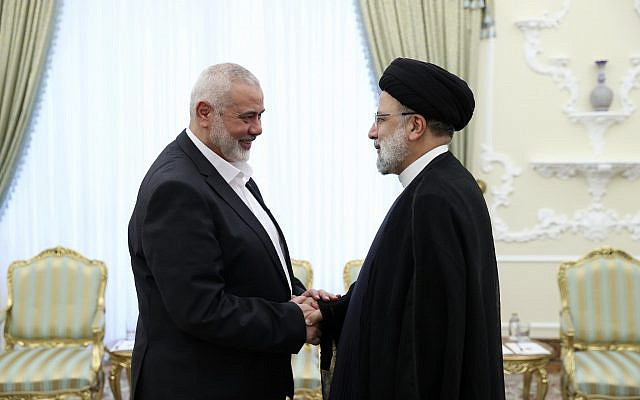 In this photo released by the Iranian Presidency Office, President Ebrahim Raisi, right, greets the leader of the Palestinian terror group Hamas, Ismail Haniyeh at the start of their meeting at his office in Tehran, Iran, on June 20, 2023. (Iranian Presidency Office via AP, File)