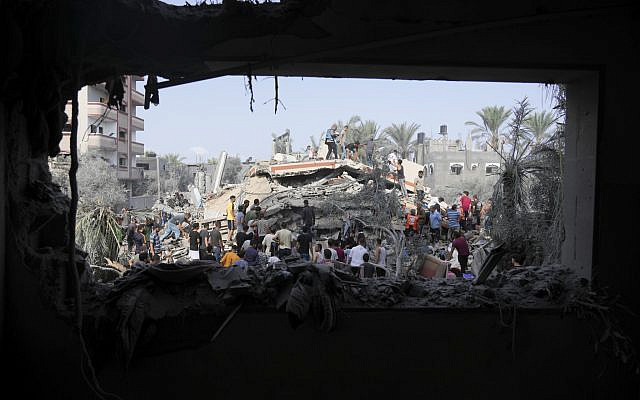 Palestinians look for survivors after what they say was Israeli bombardment in Deir Al-Balah, Gaza Strip, on Oct. 22, 2023. (AP Photo/Hatem Moussa, File)