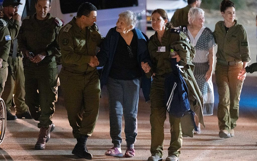 Yaffa Adar, center, being brought back home to Israel on November 24, 2023. When taken on October 7, she was photographed smiling, causing observers to ask whether she understood what was happening. Her relatives explained that she knew full well, and was defiant. (courtesy)