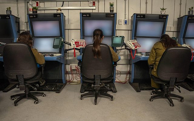 Soldiers are seen monitoring surveillance cameras at a command center at the IDF’s Re’im camp in southern Israel, November 5, 2023. (Israel Defense Forces)