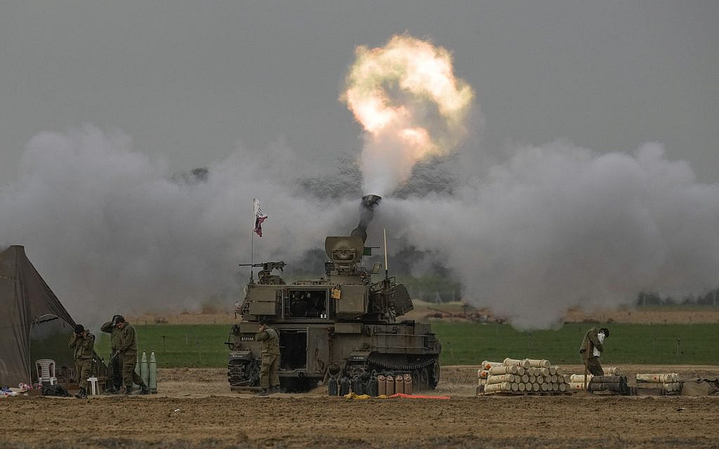 An Israeli mobile artillery unit fires a shell from southern Israel towards the Gaza Strip, in a position near the Israel-Gaza border on December 10, 2023. (AP/ Leo Correa)