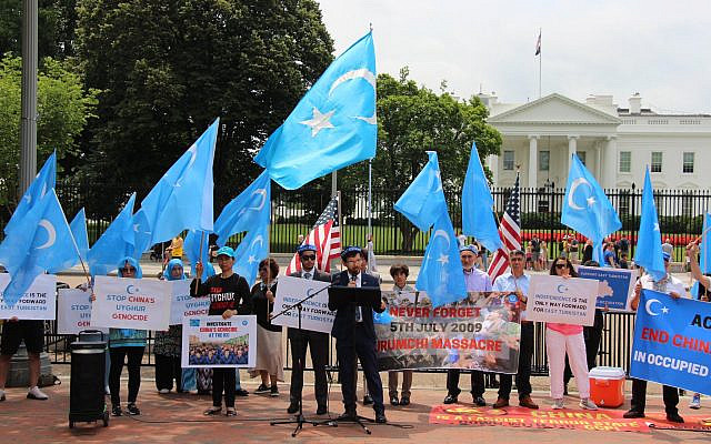 Members of the Uyghur community in Washington, DC demonstrate before the White House, decrying China's genocidal policies in East Turkistan and calling for an international response. (East Turkistan National Movement)