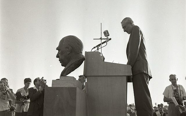 J. Robert Oppenheimer speaks at the Weizmann Institute before a bust of Niels Bohr, May 21, 1958; photograph by Boris Carmi, Meitar Collection, The Pritzker Family National Photography Collection, The National Library of Israel.