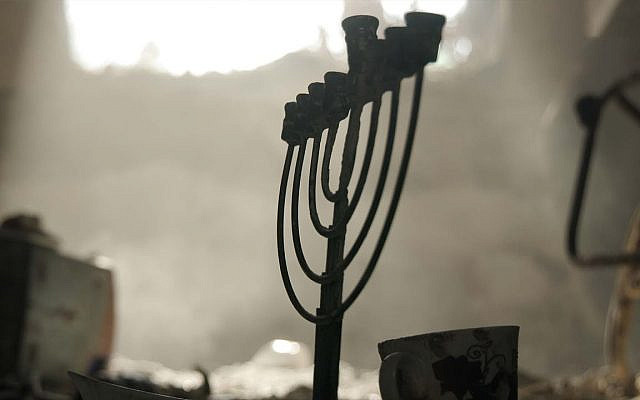 Menorah found in a home on Kibbutz Nir Oz that was destroyed in the Hamas attack on October 7, 2023. (Screenshot from Times of Israel video, 'All that is left')