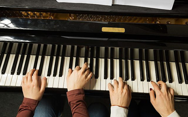 A duet on the piano. (iStock)