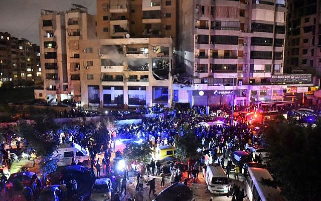 People gather at the site of a strike, reported by Lebanese media to be an Israeli strike targeting a Hamas office, in the southern suburb of Beirut on Januar 2, 2024. Photo: AFP