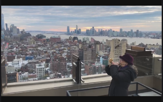 The author blows a shofar on a rooftop.  Photo used with permission.