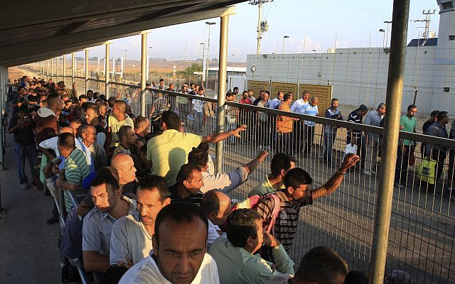 Illustrative: Palestinian workers wait to cross to Israel at the Qalqilya checkpoint. October 9, 2012. (AP Photo/ Nasser Ishtayeh/ File)