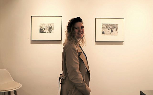 This image shows a gallery visitor at the current exhibit at La Galerie Rouge. In the background, one can see an image by Robert Doisneau on the left and an image by Sabine Weiss on the right. Photo credit: ARETE/Simone Kussatz